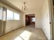 Bright living room with view to the fireplace, large window, and dining area at 1400 Russell Ave, Charlotte, NC 28216