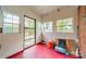 Enclosed sunroom with multiple windows, security door and an indoor-outdoor feel at 1400 Russell Ave, Charlotte, NC 28216