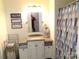Bright bathroom featuring modern vanity, mirror, and colorful shower curtain at 1414 Farmstead Rd, Rock Hill, SC 29732