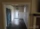 Stylish entryway with blue barn door, dark floors, modern lamps, and white wainscoting at 1414 Farmstead Rd, Rock Hill, SC 29732
