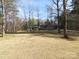 Charming gray home with a brick chimney and a large front yard perfect for outdoor activities at 1414 Farmstead Rd, Rock Hill, SC 29732