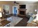 Comfortable living room features hardwood floors, a brick fireplace and modern decor at 1414 Farmstead Rd, Rock Hill, SC 29732