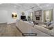 Staged living room with coffered ceilings, a stone fireplace, and plush, comfortable seating at 1415 Ashe Meadow Dr, Indian Trail, NC 28079