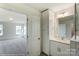 Bright bathroom with white cabinets, sink, and a doorway to a bedroom or living space at 1449 Ardmore Dr # 241, Sherrills Ford, NC 28673