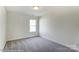 Bright, carpeted bedroom with a window, perfect for relaxation and rest at 1449 Ardmore Dr # 241, Sherrills Ford, NC 28673