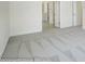Bedroom with plush gray carpeting that connects to a hallway, with access to another room at 1449 Ardmore Dr # 241, Sherrills Ford, NC 28673