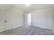 Bright bedroom with plush carpet, double doors closet, and a doorway, filled with natural light at 1449 Ardmore Dr # 241, Sherrills Ford, NC 28673