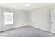 Cozy bedroom featuring soft carpet, a window, and double door closet for ample storage at 1449 Ardmore Dr # 241, Sherrills Ford, NC 28673