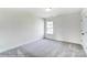 Bright, carpeted bedroom with one window, a blank canvas ready for personal touches at 1449 Ardmore Dr # 241, Sherrills Ford, NC 28673