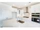 Modern kitchen with white cabinets, a large island with sink, stainless steel appliances and tile backsplash at 1449 Ardmore Dr # 241, Sherrills Ford, NC 28673