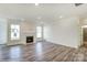 Inviting living room featuring hardwood floors, a fireplace, and large windows offering plenty of light at 1449 Ardmore Dr # 241, Sherrills Ford, NC 28673