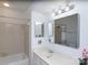 Clean bathroom with bathtub, shower, and vanity with sink and decorative lighting at 1606 Sharon W Rd # 37, Charlotte, NC 28210