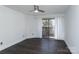 Spacious bedroom featuring a ceiling fan and sliding glass door to private patio at 1606 Sharon W Rd # 37, Charlotte, NC 28210