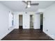 Open bedroom with multiple closets and doors that lead to the bathroom and hallway at 1606 Sharon W Rd # 37, Charlotte, NC 28210