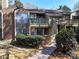 Inviting condo with a blend of brick and siding, featuring cozy balconies and a well-maintained garden at 1606 Sharon W Rd # 37, Charlotte, NC 28210