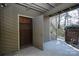 An open outdoor storage area with access door under deck at 1606 Sharon W Rd # 37, Charlotte, NC 28210