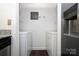 Convenient laundry area with washer, dryer hookups, and built-in shelving for ample storage at 1606 Sharon W Rd # 37, Charlotte, NC 28210