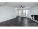 Inviting living room with fireplace and natural light, complemented by modern flooring at 1606 Sharon W Rd # 37, Charlotte, NC 28210