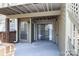 Relaxing covered patio with sliding glass doors, offering a private outdoor living space at 1606 Sharon W Rd # 37, Charlotte, NC 28210