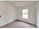 Neutral bedroom with window overlooking yard at 164 Daves Rd, York, SC 29745