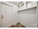 Clean laundry room featuring storage shelves and tiled flooring at 164 Daves Rd, York, SC 29745