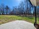 Overlooking spacious backyard with mature trees, concrete patio, perfect for outdoor gatherings at 1730 Martin Rd, Kings Mountain, NC 28086