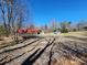 Spacious lot with a red carport and a shed, surrounded by mature trees at 1730 Martin Rd, Kings Mountain, NC 28086