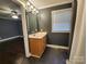 Bathroom with a wood vanity, large mirror, and shower with a curtain at 1730 Martin Rd, Kings Mountain, NC 28086