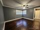 This bedroom offers hardwood floors, gray walls, natural light, and white trim at 1730 Martin Rd, Kings Mountain, NC 28086
