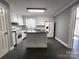 Modern kitchen with white cabinets, island, granite countertops, and stainless steel appliances at 1730 Martin Rd, Kings Mountain, NC 28086