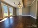 An interior view of a living room with hardwood floors and French doors at 1730 Martin Rd, Kings Mountain, NC 28086