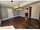 This is a living room with hardwood floors, neutral gray walls, white trim and exposed brick at 1730 Martin Rd, Kings Mountain, NC 28086