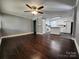 Open-concept living area seamlessly connecting to the kitchen, with hardwood floors and a ceiling fan at 1730 Martin Rd, Kings Mountain, NC 28086