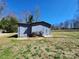 Outdoor shed with light blue painted siding and double door entry to help store your outdoor tools at 1730 Martin Rd, Kings Mountain, NC 28086