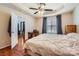 This spacious bedroom has hardwood floors, a ceiling fan, and a view into the Gathering room at 1852 Bon Rea Dr, Rock Hill, SC 29730
