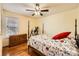 A well-lit bedroom features a ceiling fan, hardwood floors, neutral walls, and a large window at 1852 Bon Rea Dr, Rock Hill, SC 29730