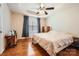 A bright bedroom features a ceiling fan, hardwood floors, neutral walls, and a large window at 1852 Bon Rea Dr, Rock Hill, SC 29730