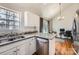 An airy kitchen features granite countertops, stainless steel appliances, and hardwood floors with an adjacent dining area at 1852 Bon Rea Dr, Rock Hill, SC 29730