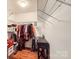 This large walk-in closet features wood floors, shelving, hanging storage and a dark accent table at 1852 Bon Rea Dr, Rock Hill, SC 29730