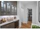 Stylish bar area with custom cabinets, a wine cooler, and a marble countertop at 19117 Davidson Concord Rd, Davidson, NC 28036