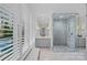 Elegant bathroom with marble floors, glass shower, and double vanity at 19117 Davidson Concord Rd, Davidson, NC 28036