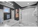 Bathroom with a marble vanity, a tub-shower combo, and dark gray walls at 19117 Davidson Concord Rd, Davidson, NC 28036