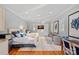 Bright bedroom boasts hardwood floors, two twin beds, and an elegant seating area at 19117 Davidson Concord Rd, Davidson, NC 28036