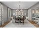 Elegant dining room with stylish lighting, wainscoting, and a large table at 19117 Davidson Concord Rd, Davidson, NC 28036