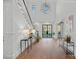 Grand foyer with high ceilings, hardwood floors, elegant staircase, and modern lighting at 19117 Davidson Concord Rd, Davidson, NC 28036