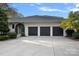 This house has a three car garage with a large driveway at 19117 Davidson Concord Rd, Davidson, NC 28036