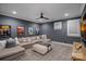 Cozy living room features a sectional sofa, neutral color palette, and movie poster wall decor at 19117 Davidson Concord Rd, Davidson, NC 28036
