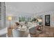Bright living room features a large sectional sofa, stylish chairs, and plenty of natural light at 19117 Davidson Concord Rd, Davidson, NC 28036