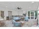 A beautiful covered outdoor kitchen features an outdoor grilling area, slate floors, and comfortable seating at 19117 Davidson Concord Rd, Davidson, NC 28036