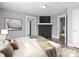 Comfortable main bedroom with hardwood floors, a cozy ambiance, and an ensuite bathroom at 200 N Martin Luther King Jr N Ave, Salisbury, NC 28144